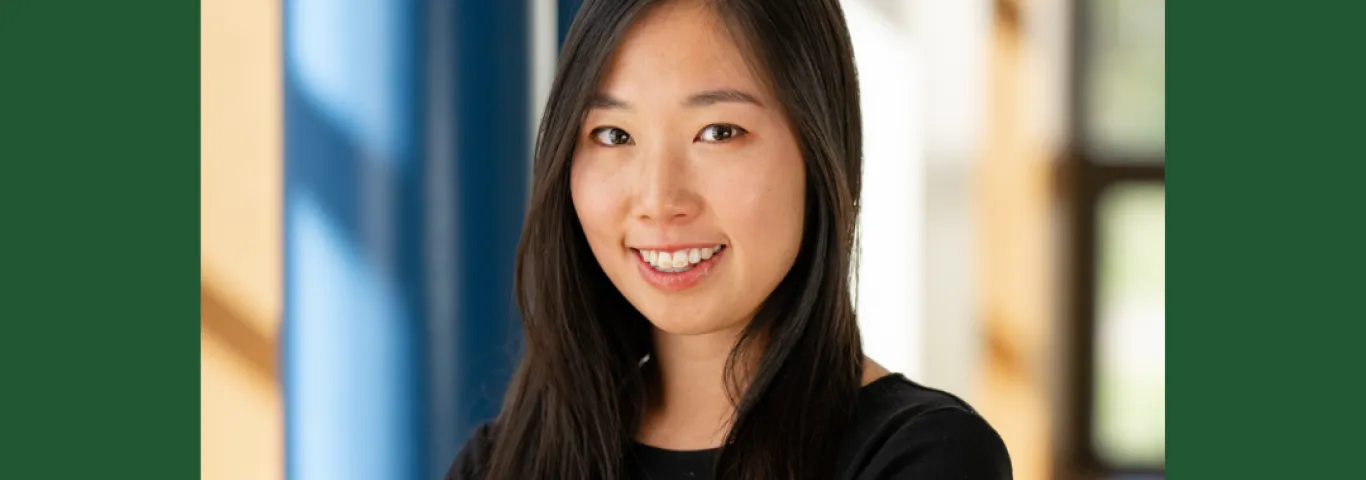 Photo of Elaine Yao smiling to camera in a black top. Underneath are the words New Article and then Incoming Faculty Member, Elaine Yao, Publishes Article in American Journal of Political Science