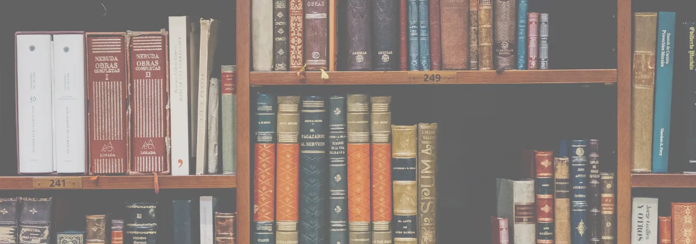 A bookshelf of various colorful books