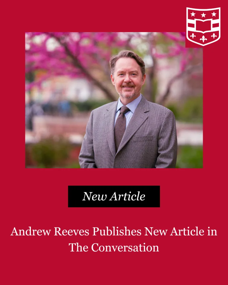 Photo of Andrew Reeves on a red background with text reading Andrew Reeves Publishes New Article in The Conversation below photo