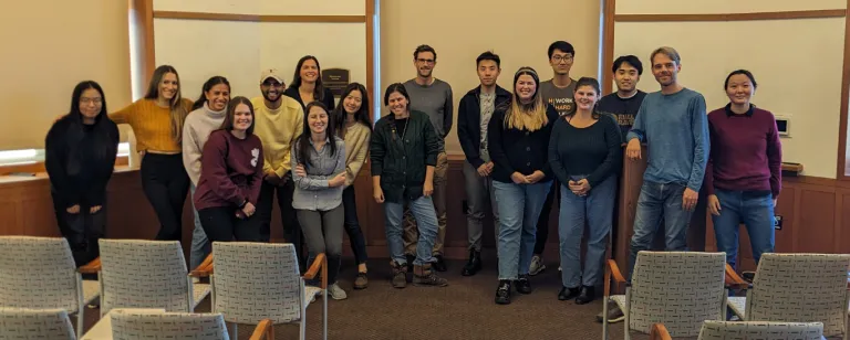 A group of international relations faculty and graduate students gather for a group photo.